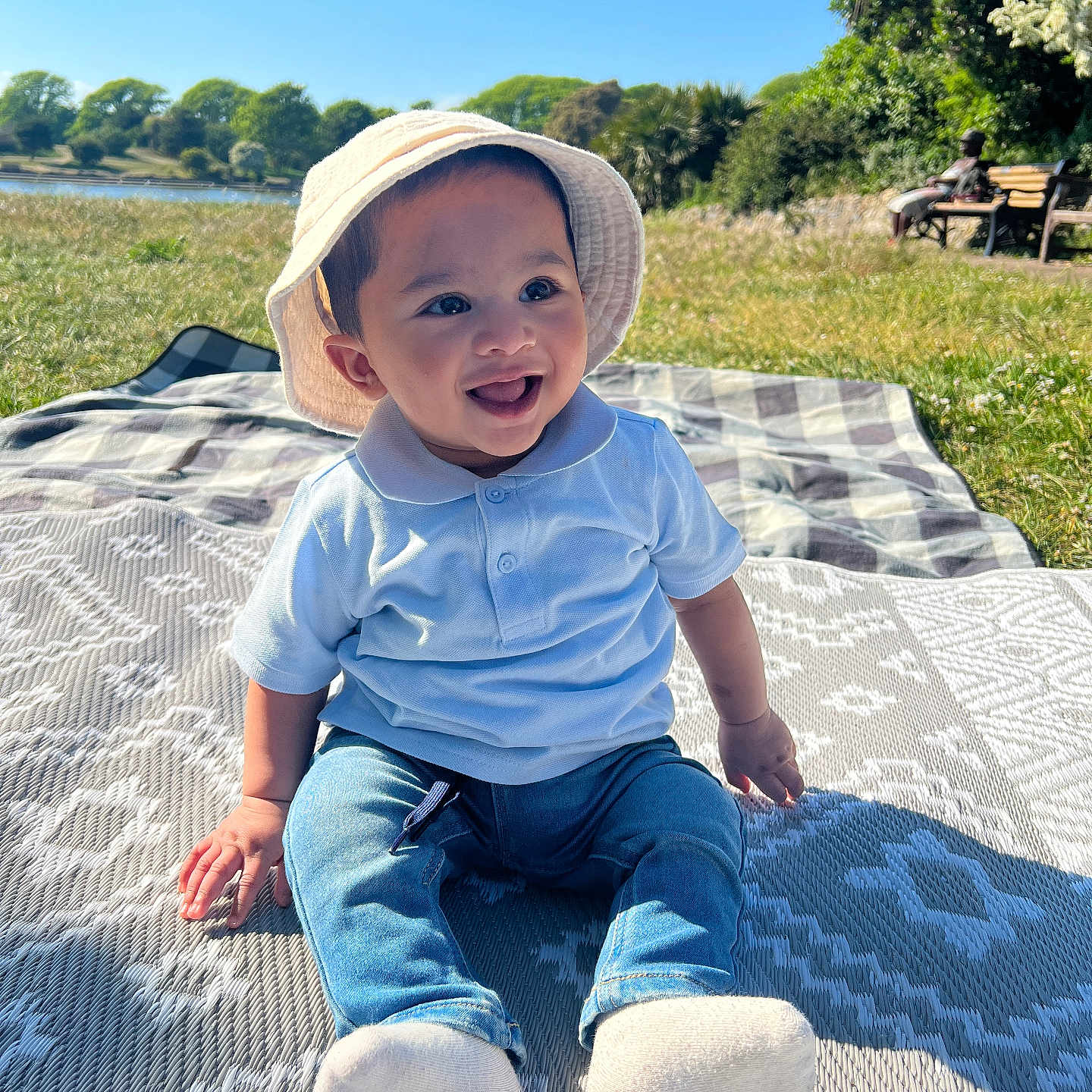 Hamza joined the competition — help win amazing prizes! baby, clothing, face, grass, happy, hat, head, hosiery, jeans, nature, outdoors, pants, park, person, photography, plant, portrait, sitting, smile, sock