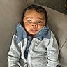 Liam joined the competition — help win amazing prizes! baby, casual, child, clothing, comfortable, cute, expression, face, hands, indoor, infant, jacket, leather_chair, person, portrait, sitting, surprised, wide_eyes, young_child, zipper