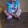 Nala Ann is registered to the contest to win money with this photo: baby, child, toddler, curly_hair, blue_bow, red_bow, wood_floor, wood_panel_wall, sitting, smiling, cute_outfit, indoor, person, portrait, happy, young_child, barefoot, playful, small, innocent