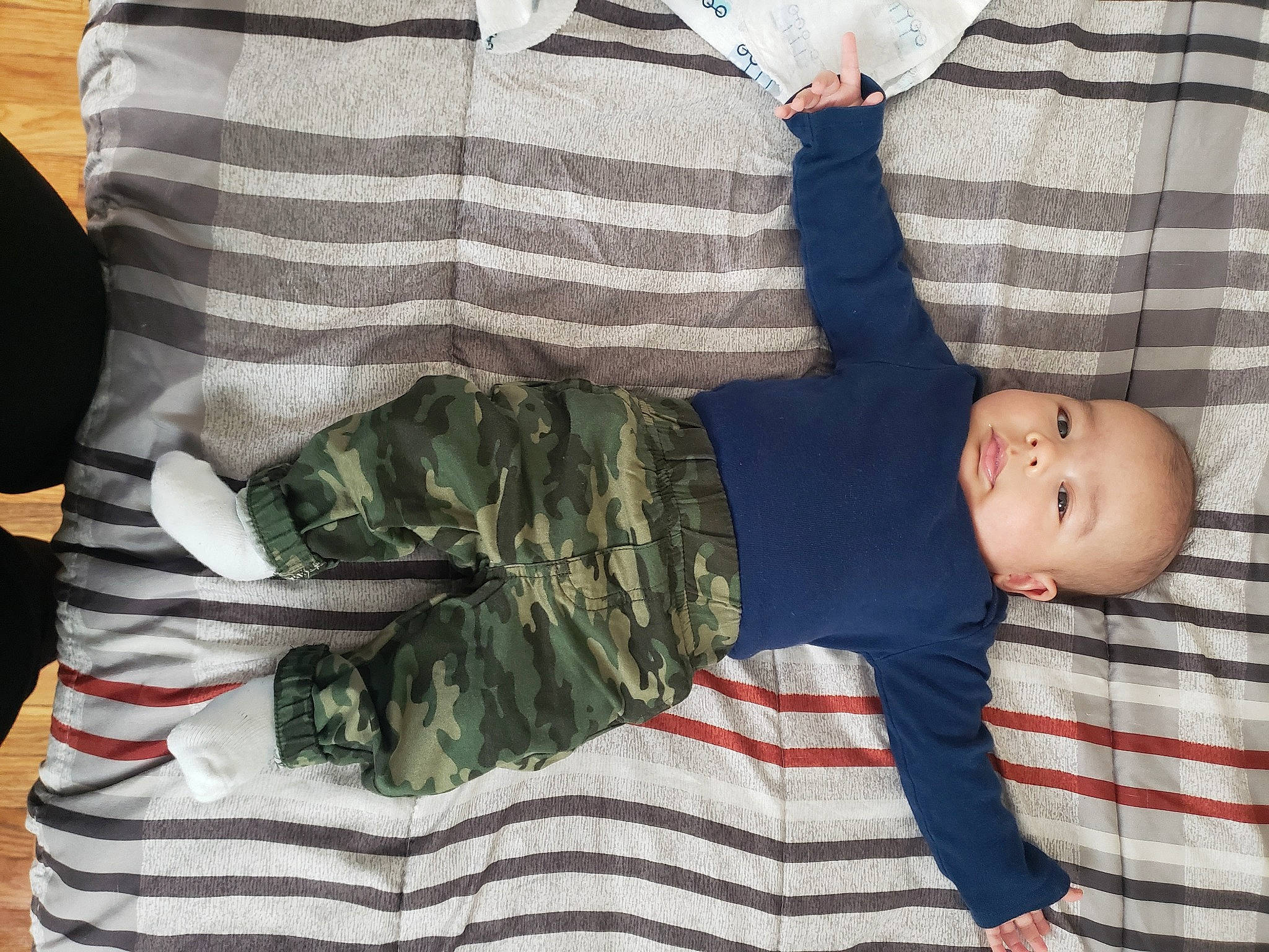 Asiah joined the competition — help win amazing prizes! baby_toddler_clothing, camouflage, comfort, gesture, happy, human_body, human_leg, leg, linens, military_camouflage, pattern, person, plaid, product, sleeve, smile, t_shirt, textile, thigh, toddler