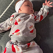 Nova is registered to the contest to win money with this photo: baby, bunny_ears, child, christmas, cozy, cute, fabric, gray_background, headband, holiday_theme, indoors, infant, lying_down, pajamas, person, portrait, reaching_hand, santa_claus, sleepwear, soft_texture
