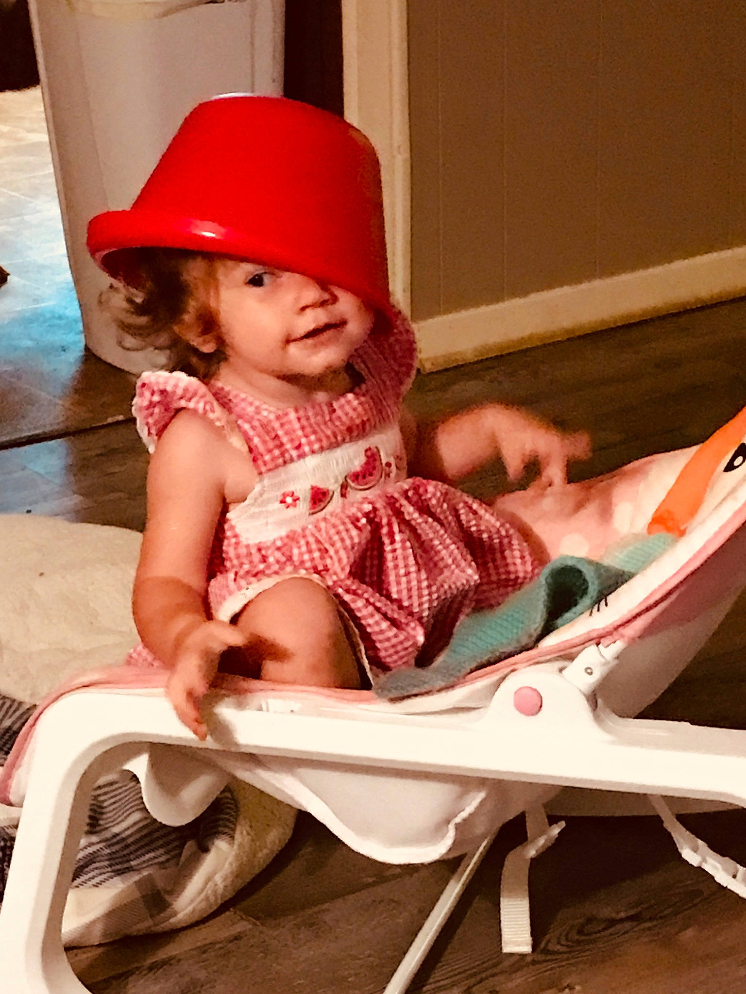 Lillie is registered to the contest to win money with this photo: baby, baby_toddler_clothing, chair, child, comfort, face, facial_expression, fun, hairstyle, happy, hat, headwear, human_leg, leisure, magenta, people, person, pink, sitting, skin