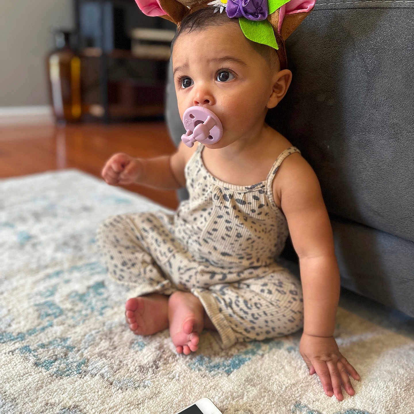 Olive is registered to the contest to win money with this photo: baby, bodypart, clothing, couch, cushion, dress, electronics, face, finger, food, furniture, hand, head, homedecor, mobilephone, person, phone, photography, portrait, sitting