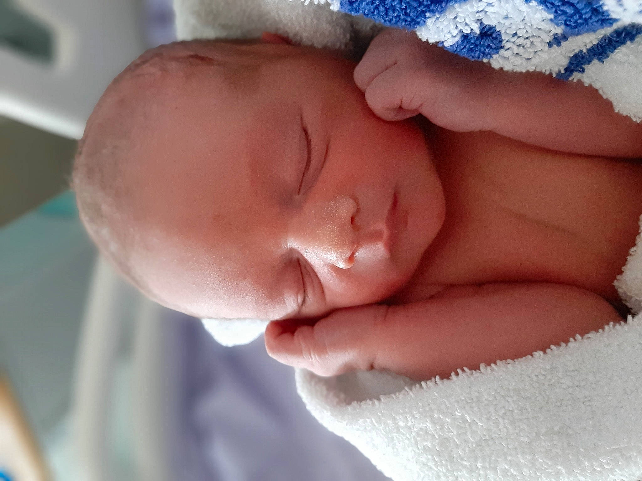 Heath is registered to the contest to win money with this photo: arm, baby, baby_sleeping, baby_toddler_clothing, blue, cheek, clothing, comfort, ear, eyelash, gesture, hand, human_body, iris, lip, mouth, neck, nose, person, skin