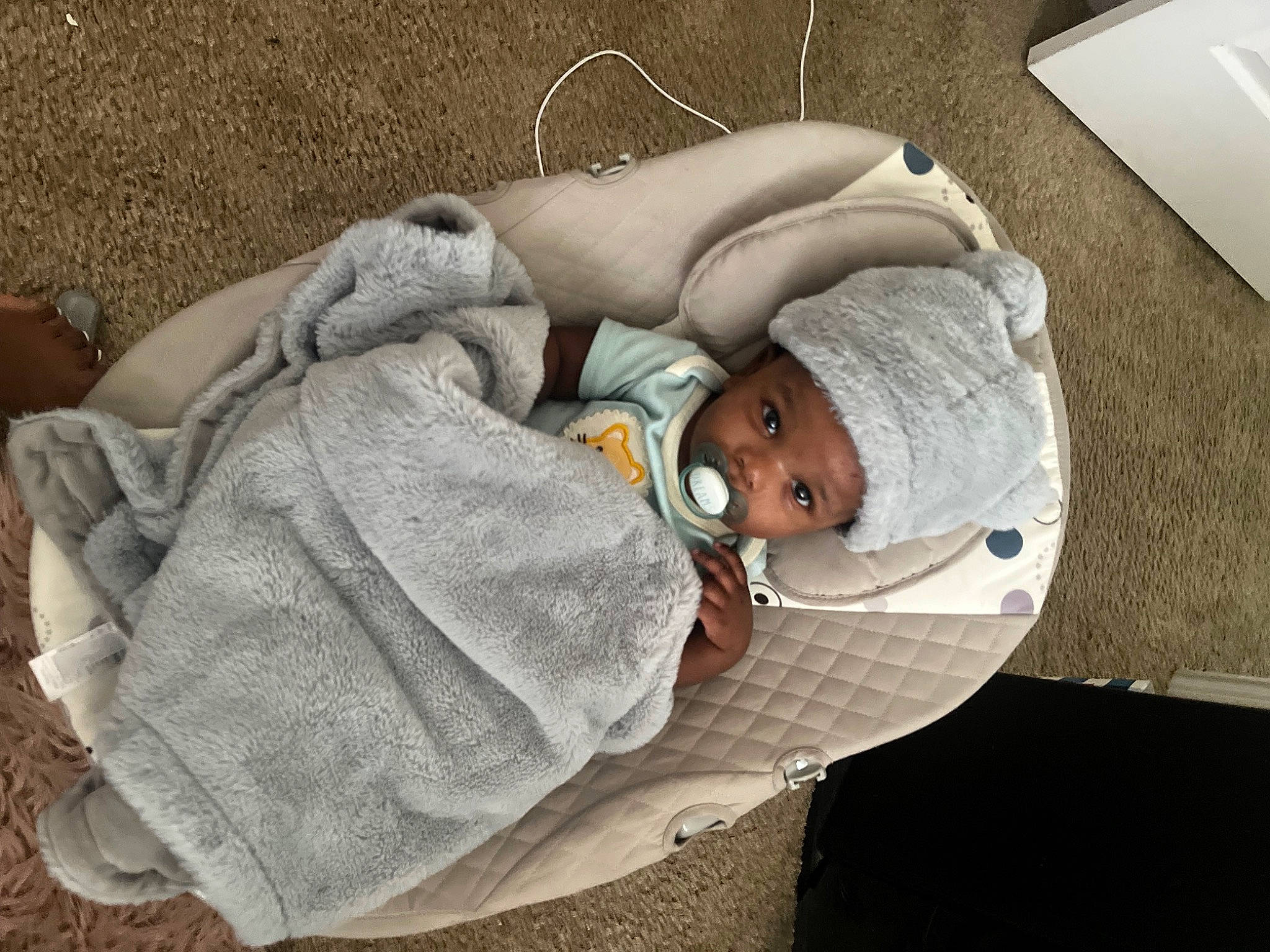 Antonio joined the competition — help win amazing prizes! baby, baby_carriage, baby_products, baby_sleeping, baby_toddler_clothing, child, comfort, glasses, grass, hat, headwear, knit_cap, linens, nap, person, room, sitting, sunglasses, textile, toddler