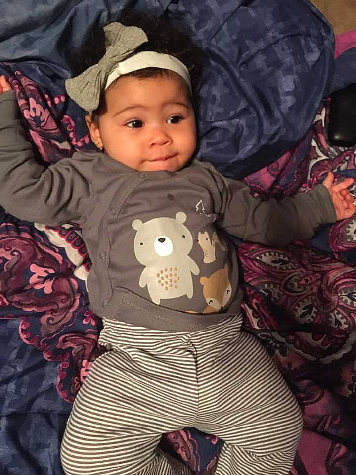 Cassie is registered to the contest to win money with this photo: baby, baby_products, baby_toddler_clothing, bonnet, button, cap, child, nose, pattern, person, plush, stuffed_toy, textile, toddler, toy