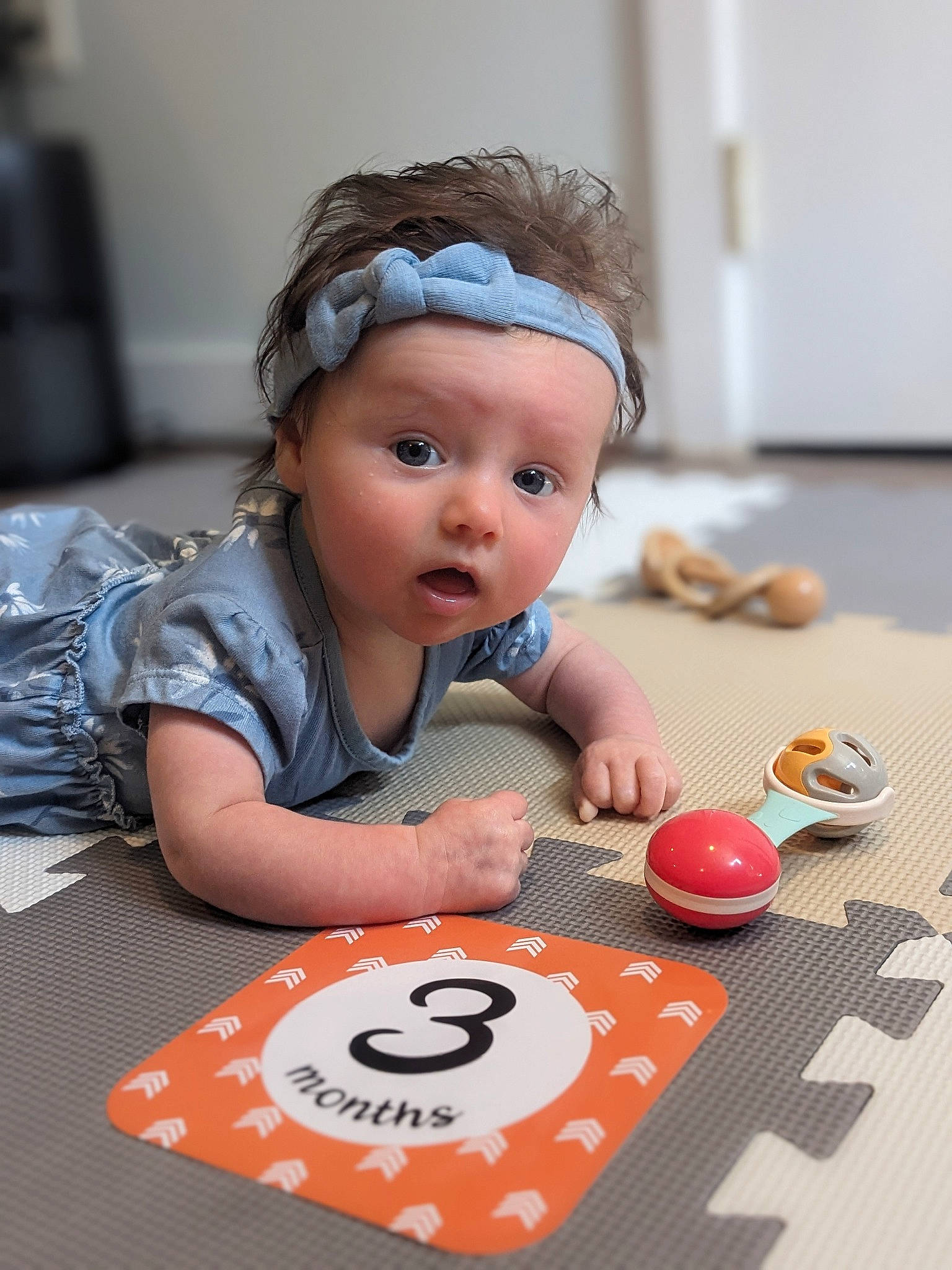 Natalie is registered to the contest to win money with this photo: baby, baby_toddler_clothing, baking, carmine, child, comfort_food, cuisine, dessert, event, facial_expression, flooring, fun, happy, headwear, person, recreation, room, sitting, surprise, sweetness