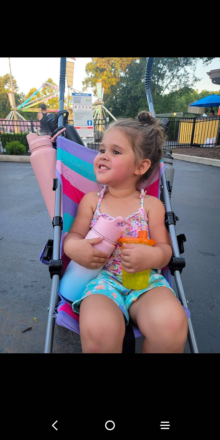 Johanna joined the competition — help win amazing prizes! child, electric_blue, event, fun, grass, happy, human_leg, leg, leisure, magenta, motor_vehicle, person, pink, recreation, shorts, skin, sky, thigh, tire, toddler