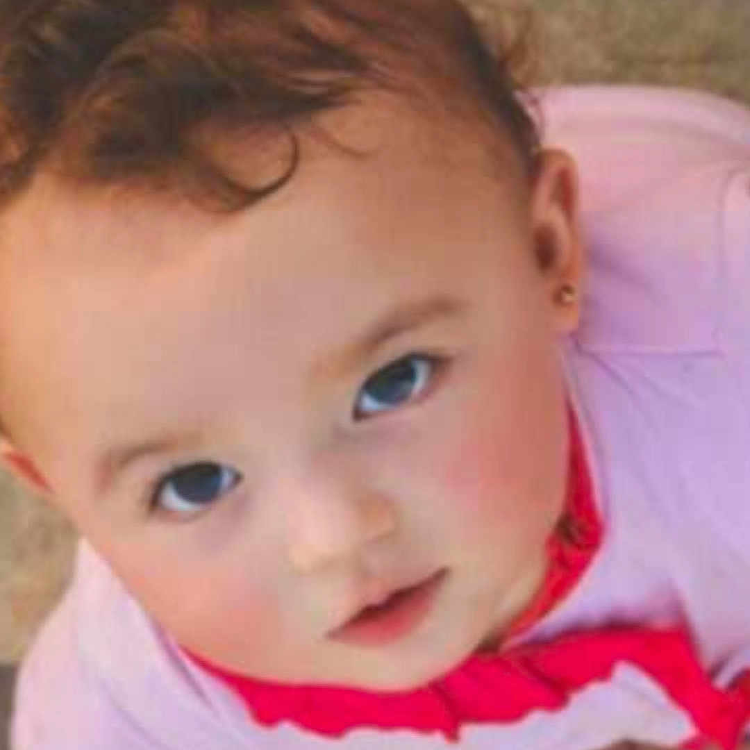 Stephanie a rejoint le concours — aidez-le/la à gagner de superbes lots ! baby, child, close_up, curly_hair, cute, earring, expression, eyes, face, head, innocent, looking_up, outdoor, person, pink_clothing, portrait, red_collar, skin, toddler, young_child
