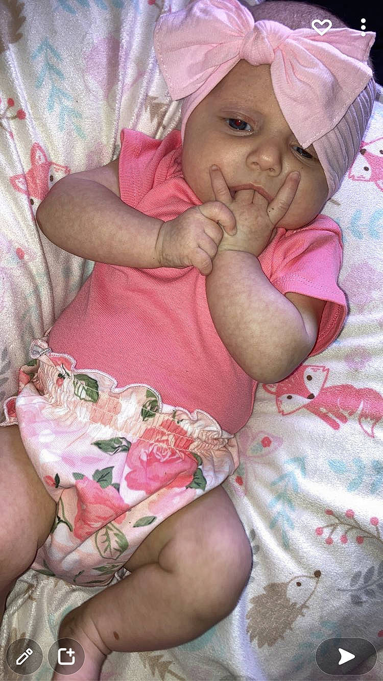 Claire joined the competition — help win amazing prizes! baby, baby_sleeping, baby_toddler_clothing, cheek, child, comfort, finger, gesture, happy, headwear, human_leg, lap, linens, lip, magenta, mammal, mouth, person, pink, skin