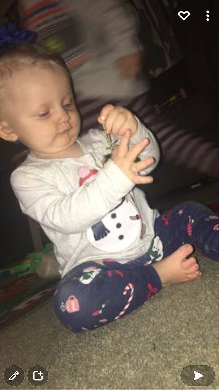 Kendal joined the competition — help win amazing prizes! baby, baby_toddler_clothing, carmine, cheek, child, comfort, face, facial_expression, flooring, foot, fun, head, lap, leg, mouth, person, sitting, skin, sleeve, thumb