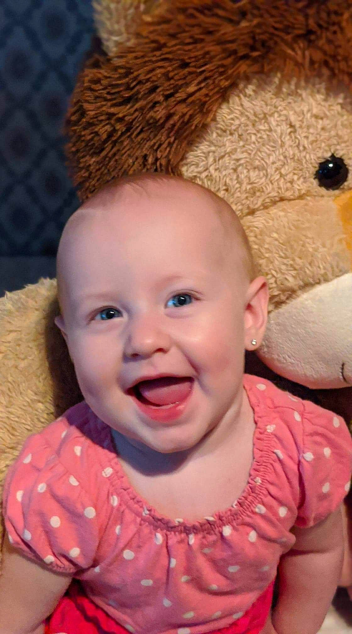 Nikole is registered to the contest to win money with this photo: baby, cheek, child, chin, eye, face, facial_expression, forehead, happy, head, headgear, iris, joy, lip, mouth, nose, person, pink, portrait_photography, skin