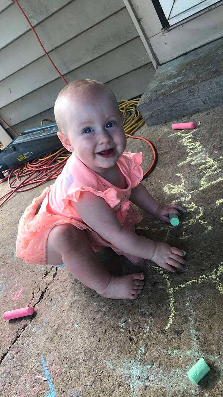 Nikole is registered to the contest to win money with this photo: baby, chalk, child, concrete, joy, leg, person, pink, play, smile, toddler