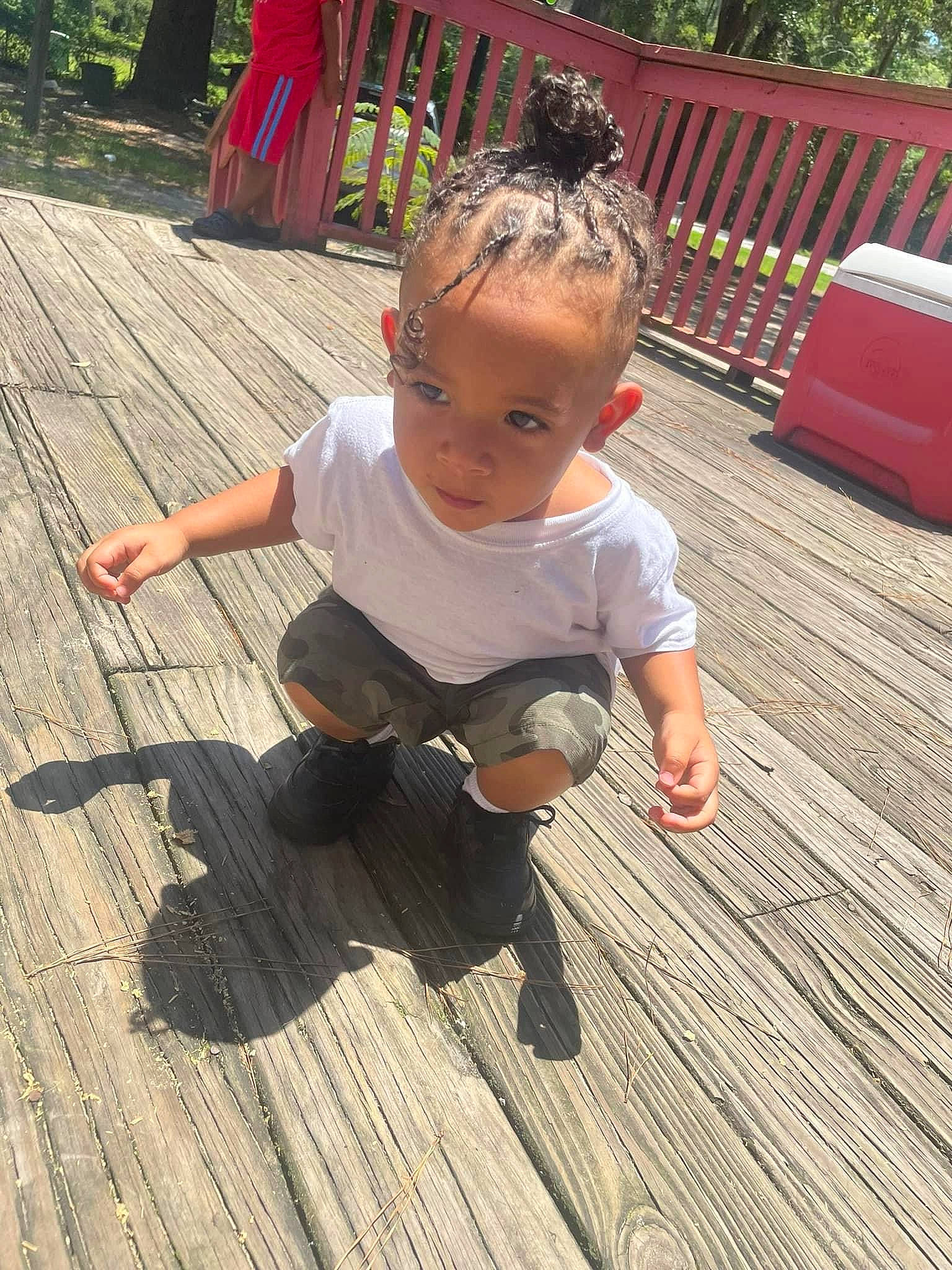 Messiah joined the competition — help win amazing prizes! baby, baby_toddler_clothing, child, deck, flooring, foot, fun, grass, hardwood, leisure, person, plant, play, sitting, t_shirt, toddler, tree, vacation, wood, wood_flooring