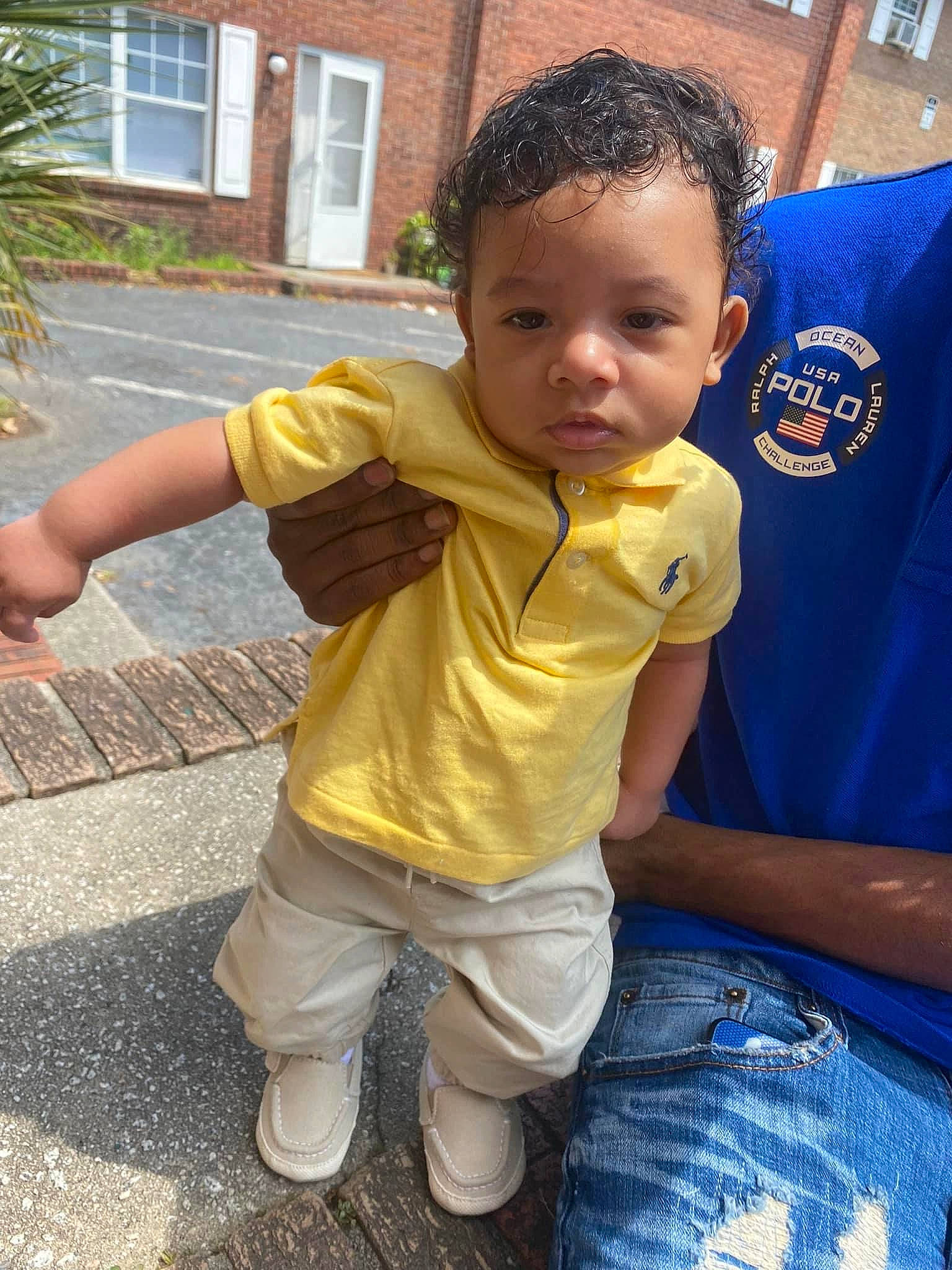 Messiah joined the competition — help win amazing prizes! baby, baby_toddler_clothing, child, cool, fun, gesture, grass, hairstyle, happy, leisure, person, plant, recreation, shorts, sitting, sleeve, standing, t_shirt, thumb, toddler