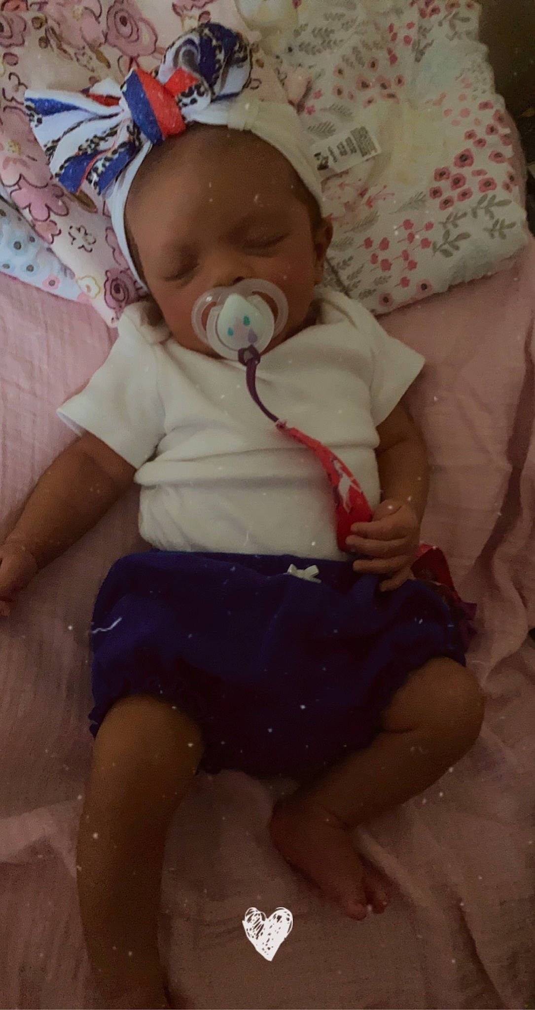 Zola is registered to the contest to win money with this photo: baby, baby_products, baby_sleeping, baby_toddler_clothing, cheek, child, comfort, eye, facial_expression, head, human_leg, linens, mouth, person, photograph, pink, sitting, skin, sleeve, thigh