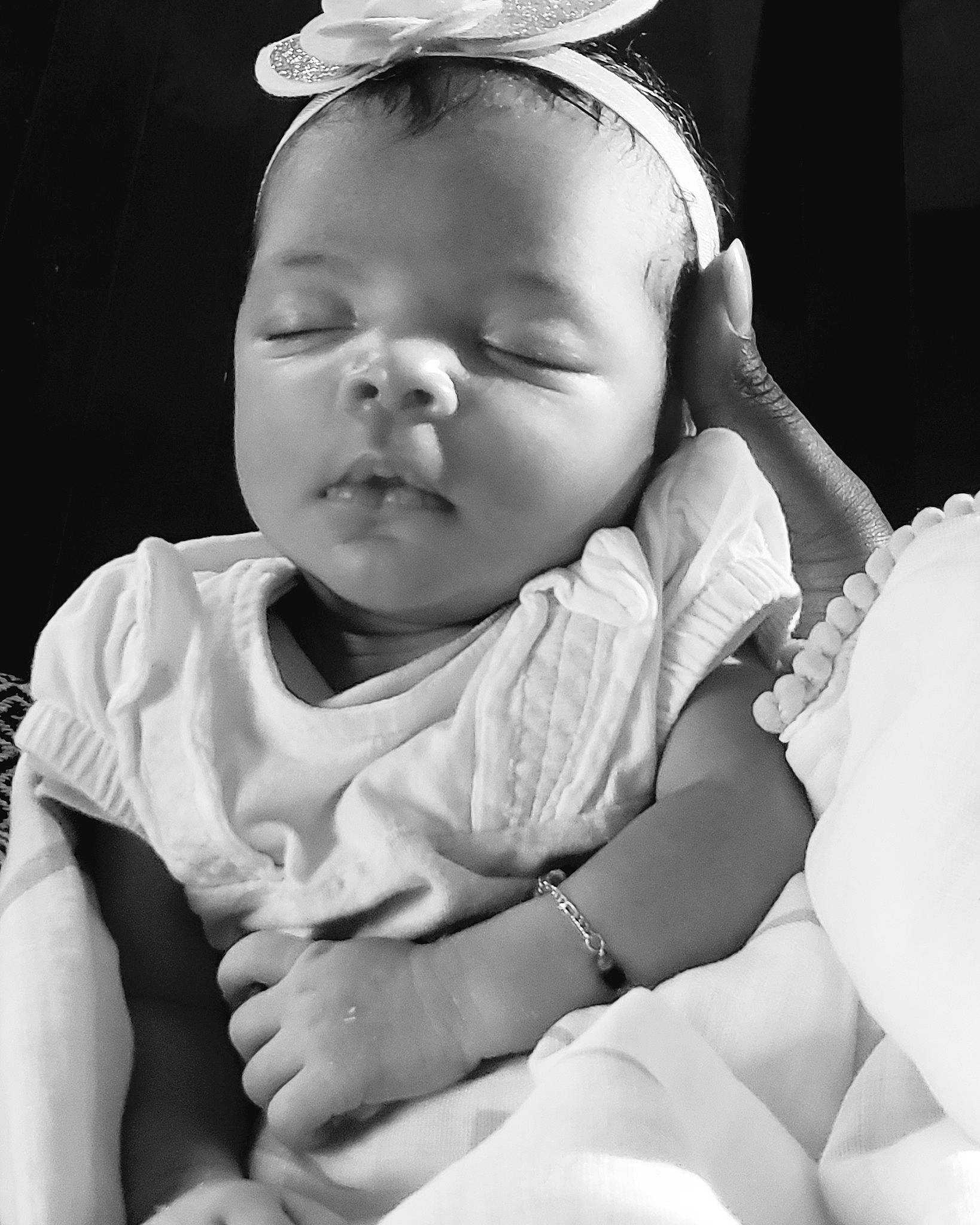 Ella Rose joined the competition — help win amazing prizes! baby, black, black_and_white, cheek, child, face, facial_expression, hand, head, monochrome, monochrome_photography, mouth, nose, people, person, photograph, photography, skin, smile, toddler