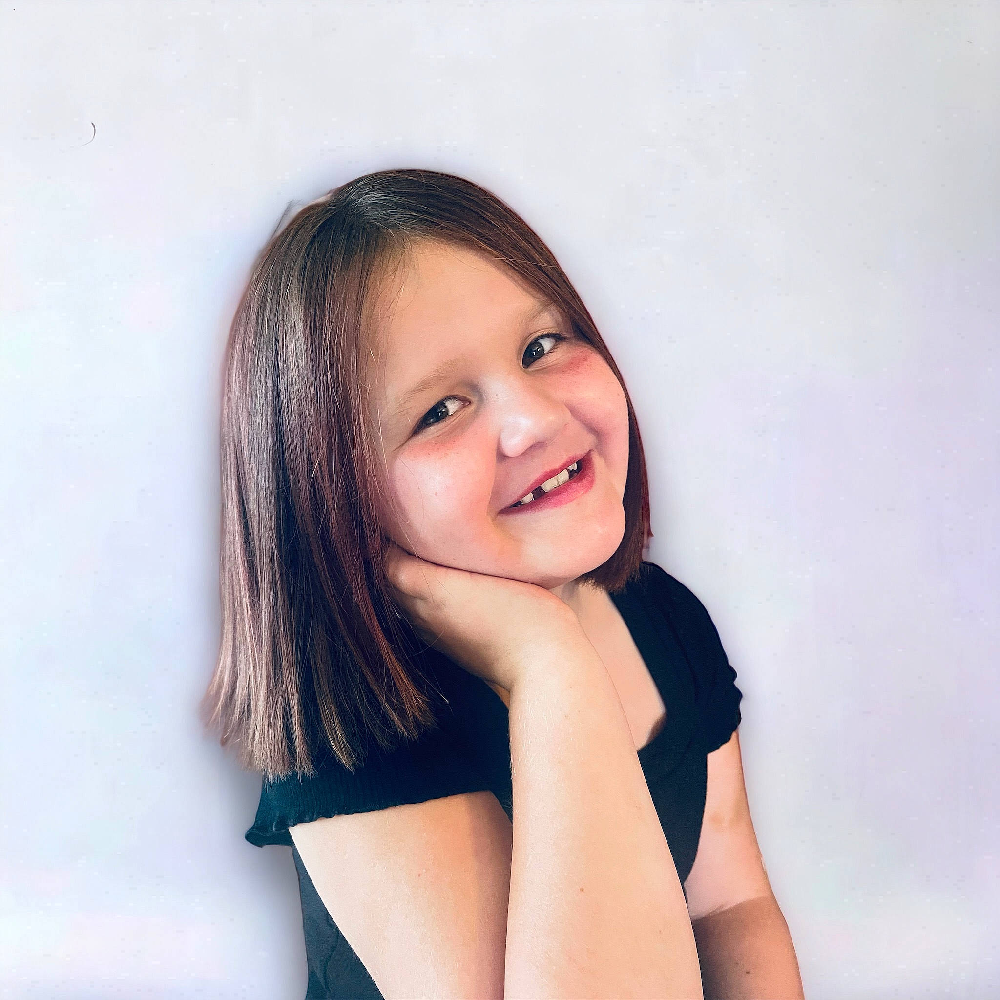 Della Simons joined the competition — help win amazing prizes! black_hair, brown_hair, cheek, elbow, electric_blue, eyelash, flash_photography, gesture, happy, human_body, human_leg, iris, joy, knee, lip, long_hair, person, sitting, sleeve, smile