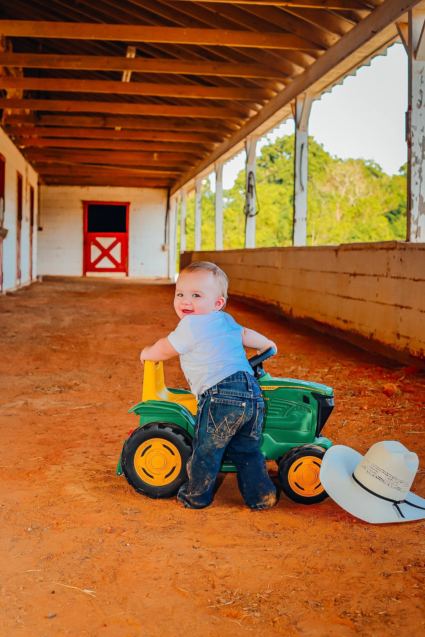 Keaton joined the competition — help win amazing prizes! automotive_tire, child, fun, grass, happy, house, landscape, leisure, person, play, public_space, recreation, riding_toy, rolling, soil, tire, toddler, tree, wheel, wood