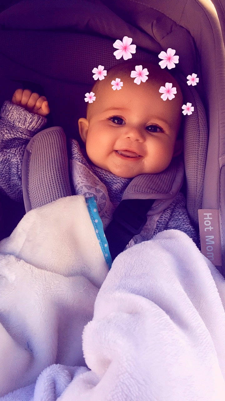 Layanna participe au concours pour gagner de l'argent avec cette photo : baby, cheek, child, eye, face, fun, hair_accessory, happy, head, headgear, headpiece, person, pink, purple, skin, smile, toddler