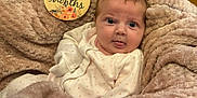 Lottie joined the competition — help win amazing prizes! baby, blanket, doll, face, head, newborn, person, photography, portrait, quilt, teddybear, towel, toy