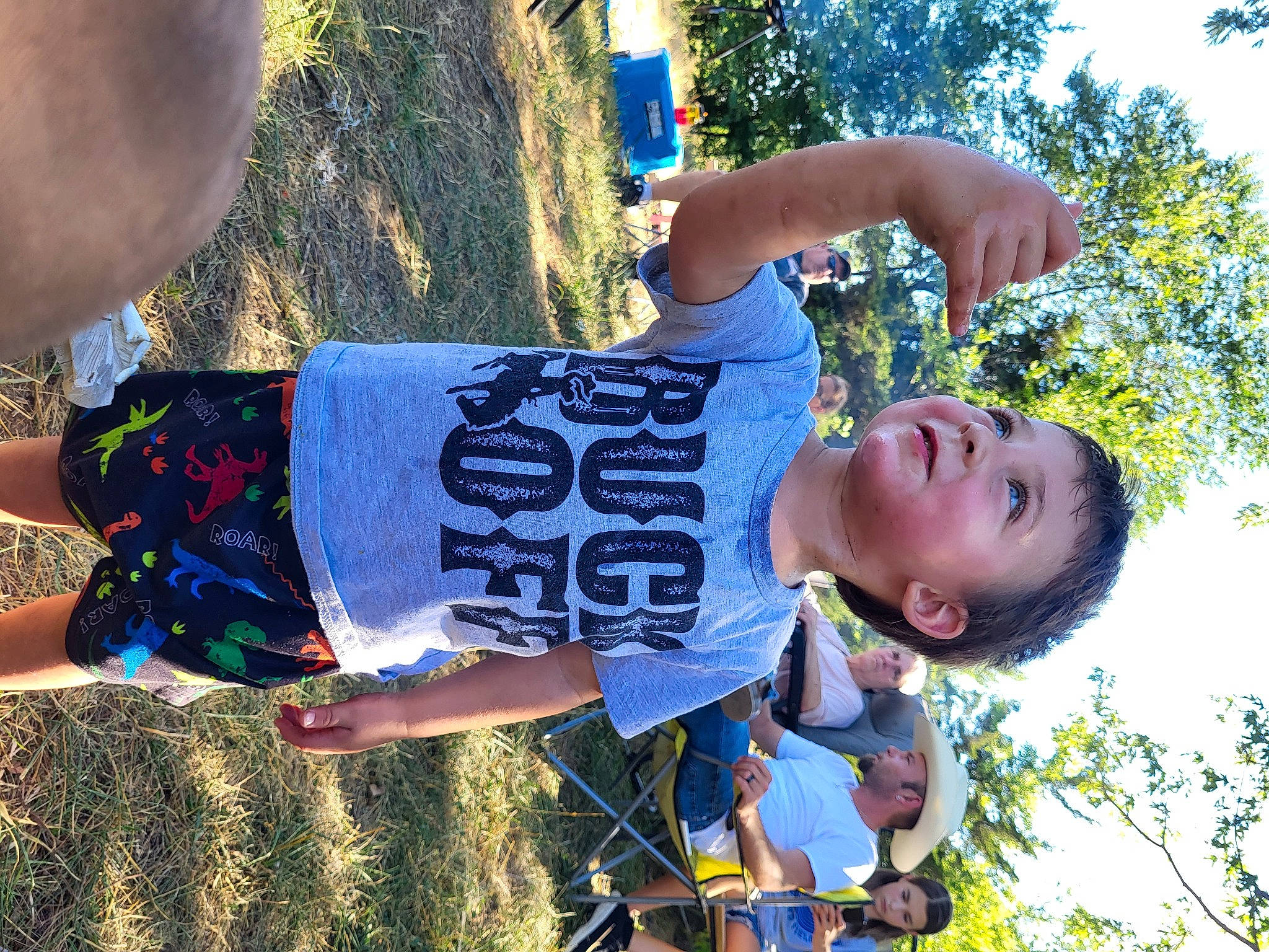 Milan is registered to the contest to win money with this photo: child, clothing, electric_blue, fun, grass, happy, headwear, leisure, people_in_nature, person, plant, play, recreation, sky, smile, soil, t_shirt, toddler, tree, vacation