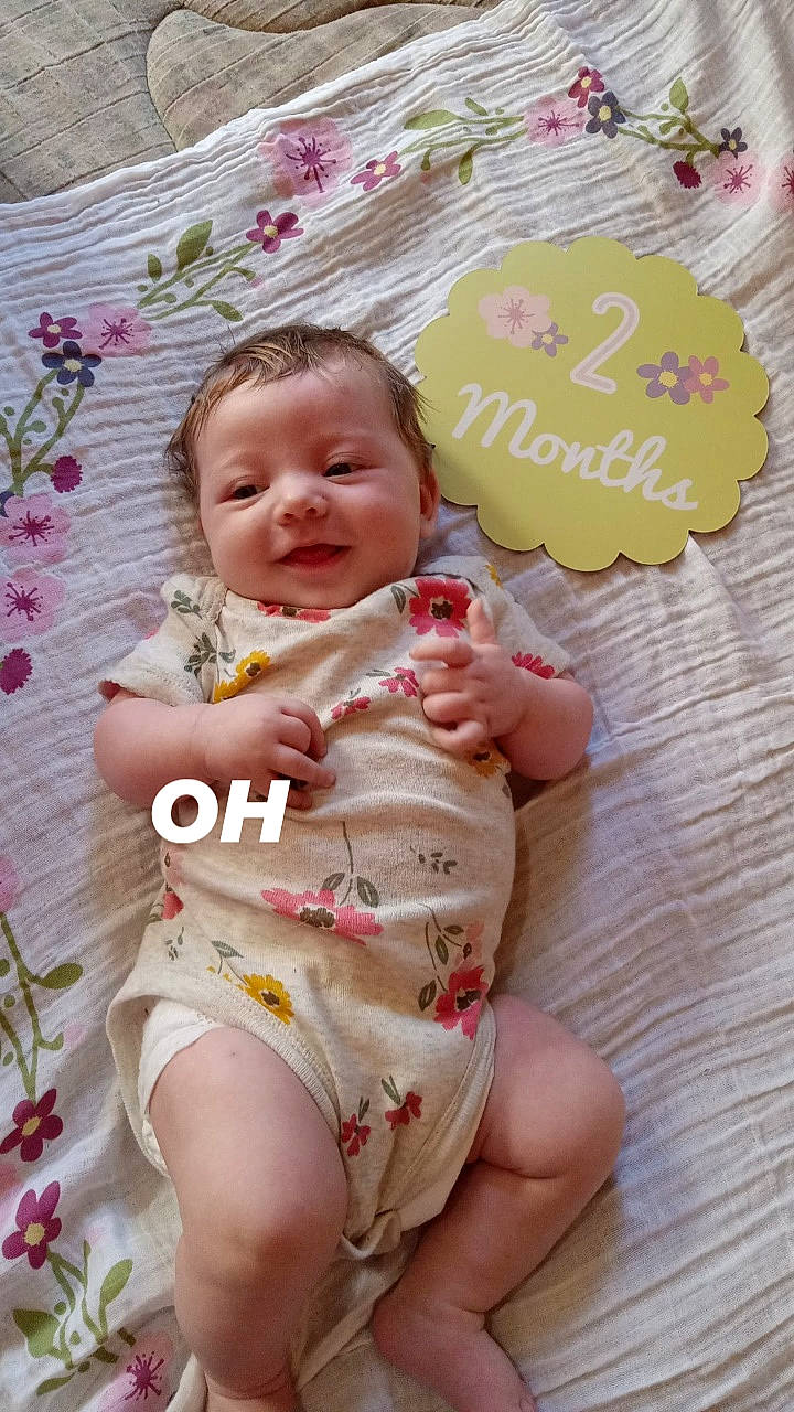 Mckenna joined the competition — help win amazing prizes! baby, baby_toddler_clothing, cheek, child, finger, foot, grass, happy, head, human_leg, joy, nail, pattern, people_in_nature, person, pink, skin, smile, stomach, thigh