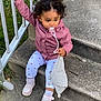 toddler, child, pacifier, stairs, concrete, railing, curly_hair, pink_jacket, leggings, white_shoes, outdoor, grass, toy, holding, sitting, curious, person, footwear, clothing, daylight