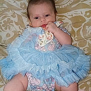 Summer joined the competition — help win amazing prizes! baby, infant, blue_tutu, floral_outfit, blanket, patterned_background, chubby_cheeks, hand, face, cute, sitting, soft_cloth, indoors, skin, head, legs, footwear, person, young_child, resting