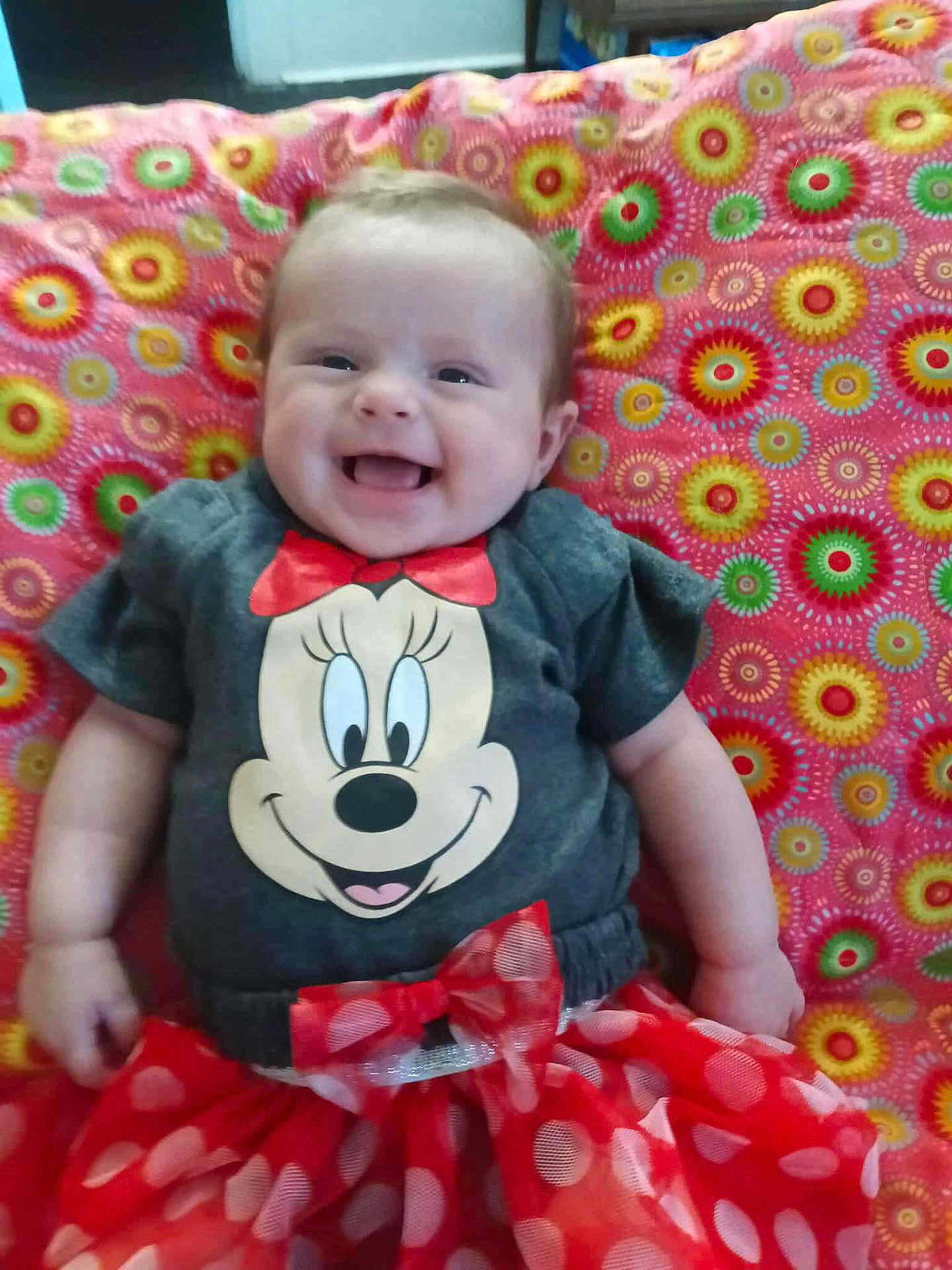 Summer joined the competition — help win amazing prizes! baby, child, smiling, minnie_mouse, tshirt, red_skirt, polka_dots, blanket, colorful, pattern, happy, infant, portrait, clothing, cute, sitting, fun, indoors, person, fashion