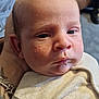 Arley is registered to the contest to win money with this photo: baby, infant, face, skin, hand, bracelet, couch, clothing, portrait, indoors, person, newborn, closeup, expression, young, human, resting, casual, sleeve, background