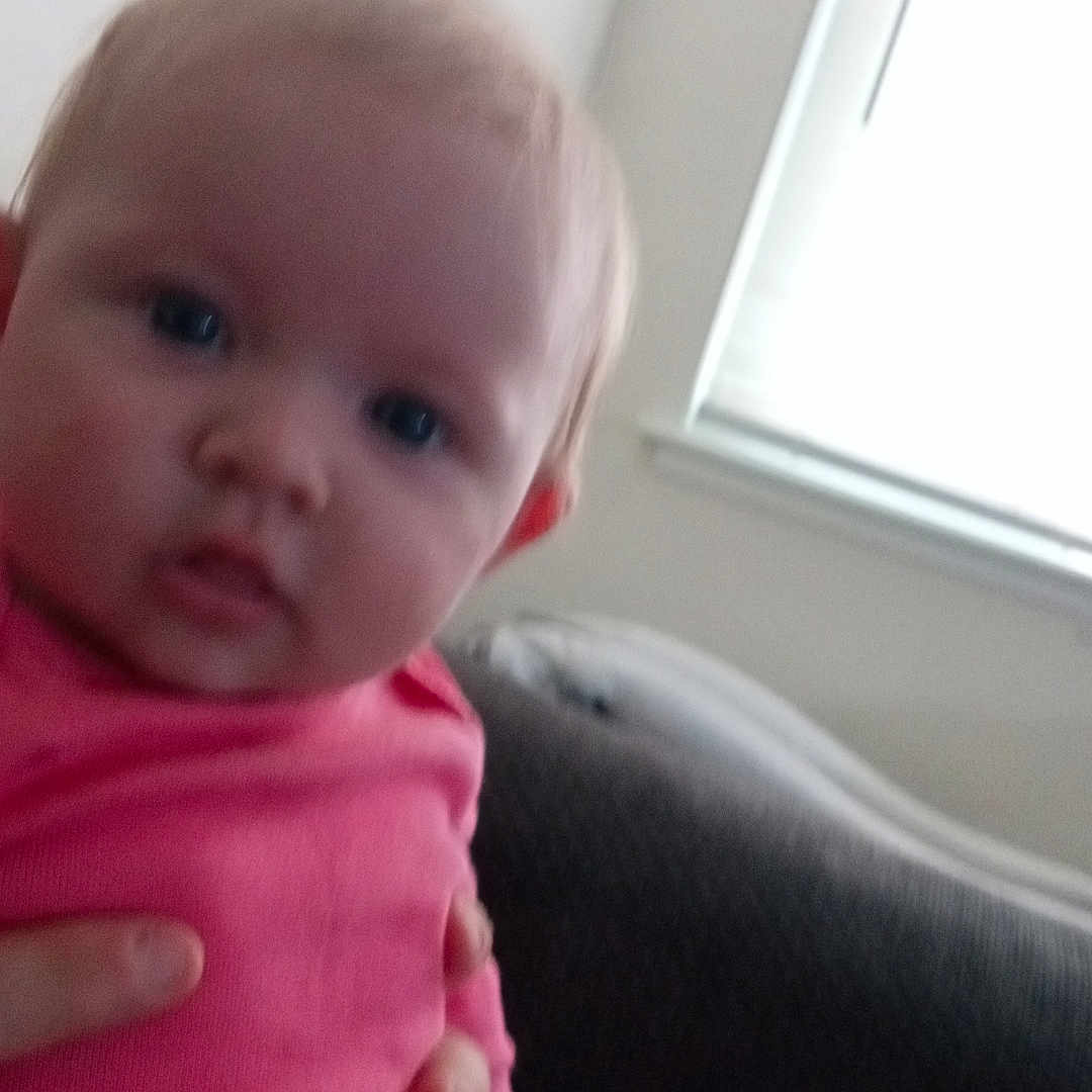 Ariel joined the competition — help win amazing prizes! baby, blanket, bodypart, clothing, couch, cushion, face, finger, furniture, hand, head, homedecor, newborn, pants, person, photography, portrait, sitting, t_shirt, window