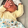 newborn, baby, sleeping, infant, portrait, face, hand, pacifier, blanket, onesie, mittens, bed, pillow, indoors, resting, peaceful, cute, closeup, child, textile