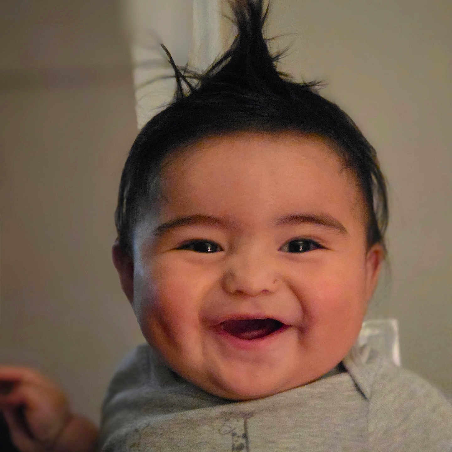 Enzo joined the competition — help win amazing prizes! baby, child, smiling, happy, mohawk, hair, face, onesie, giraffe_print, cute, portrait, indoors, infant, cheerful, dimple, person, young_child, casual_clothing, closeup, funny_hair