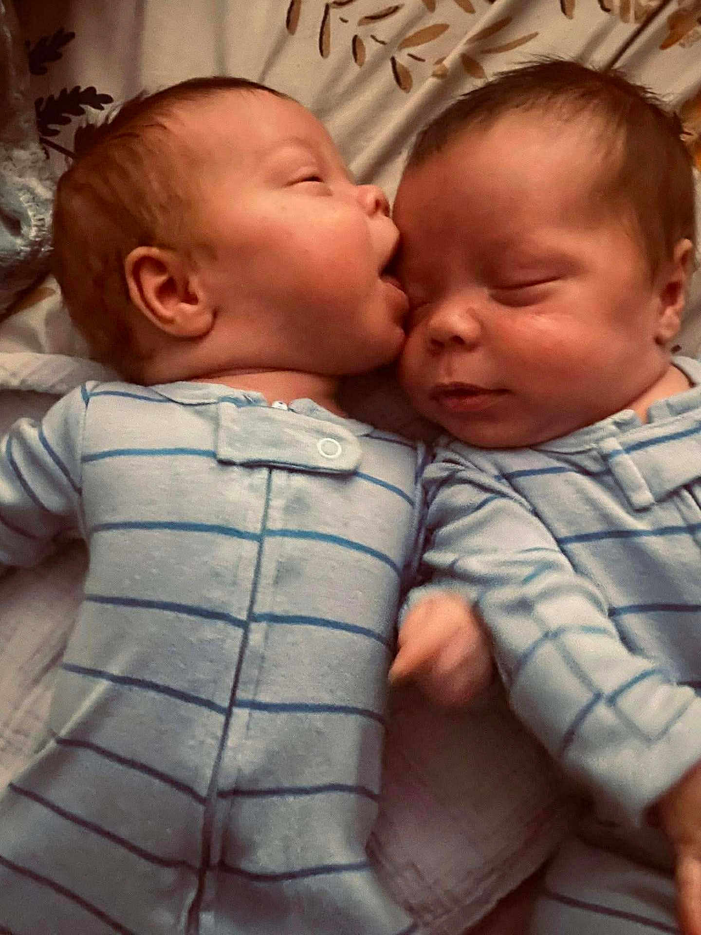 Leon And Waylon is registered to the contest to win money with this photo: baby, infant, sleeping, cute, twin, pajamas, striped_clothing, closeup, face, cheek, sleep, bed, blanket, newborn, resting, skin, child, adorable, cuddle, peaceful