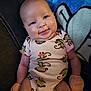 Miracle joined the competition — help win amazing prizes! adorable, baby, blanket, child, clothing, couch, cozy, cute, face, happy, indoor, infant, mittens, monkey_print, onesie, portrait, sitting, skin, smile, young