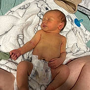Asher joined the competition — help win amazing prizes! baby, blanket, child, comfort, cute, diaper, hat, indoors, infant, legs, newborn, pacifier, peaceful, person, rest, skin, sleeping, soft, tattoo, toddler