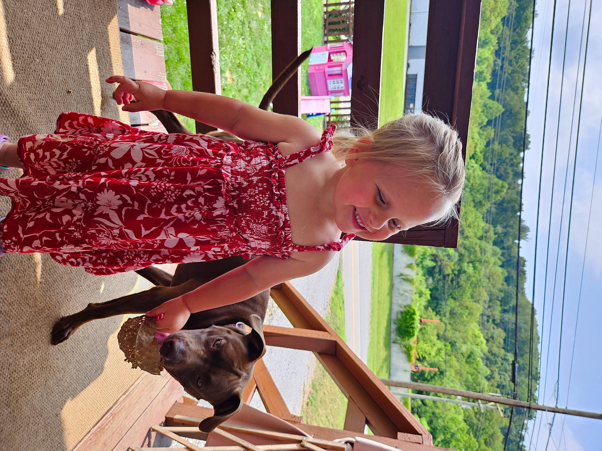 Corinne is registered to the contest to win money with this photo: baby_toddler_clothing, child, cloud, day_dress, fun, green, happy, human_leg, joy, leisure, magenta, pattern, person, recreation, sky, summer, thigh, toddler, tree, waist