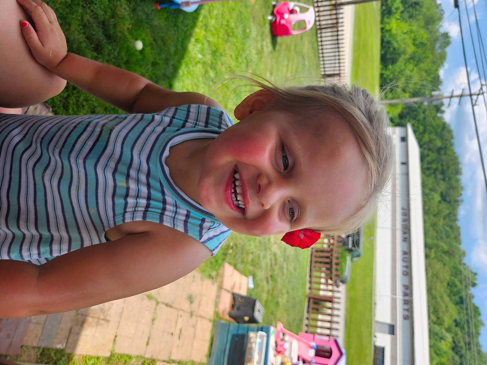 Corinne is registered to the contest to win money with this photo: beauty, child, facial_expression, fun, grass, green, happy, joy, leisure, light, people_in_nature, person, plant, recreation, red, shorts, sky, smile, summer, toddler