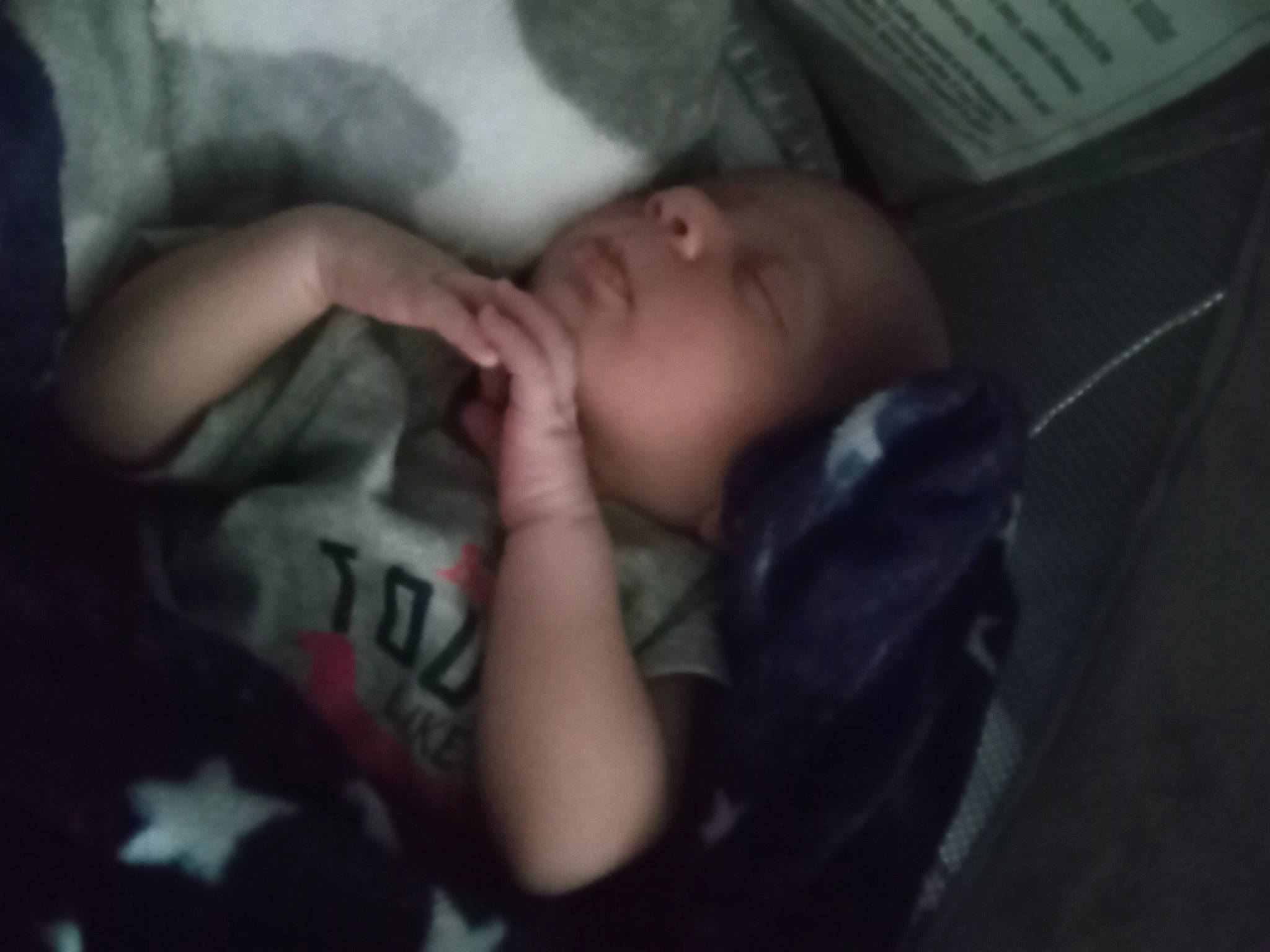 Blayne is registered to the contest to win money with this photo: baby, baby_toddler_clothing, bed, bedtime, cheek, child, comfort, darkness, ear, elbow, eyelash, flash_photography, gesture, jaw, mouth, nose, person, room, sleeve, thumb