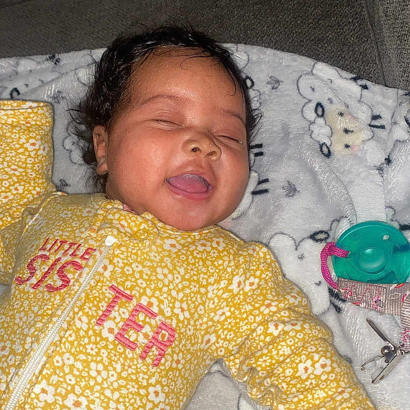 Jahnae joined the competition — help win amazing prizes! baby, bed, clothing, couch, crib, cushion, face, furniture, glove, happy, head, homedecor, infantbed, laughing, newborn, person, photography, portrait, scissors, sleeping