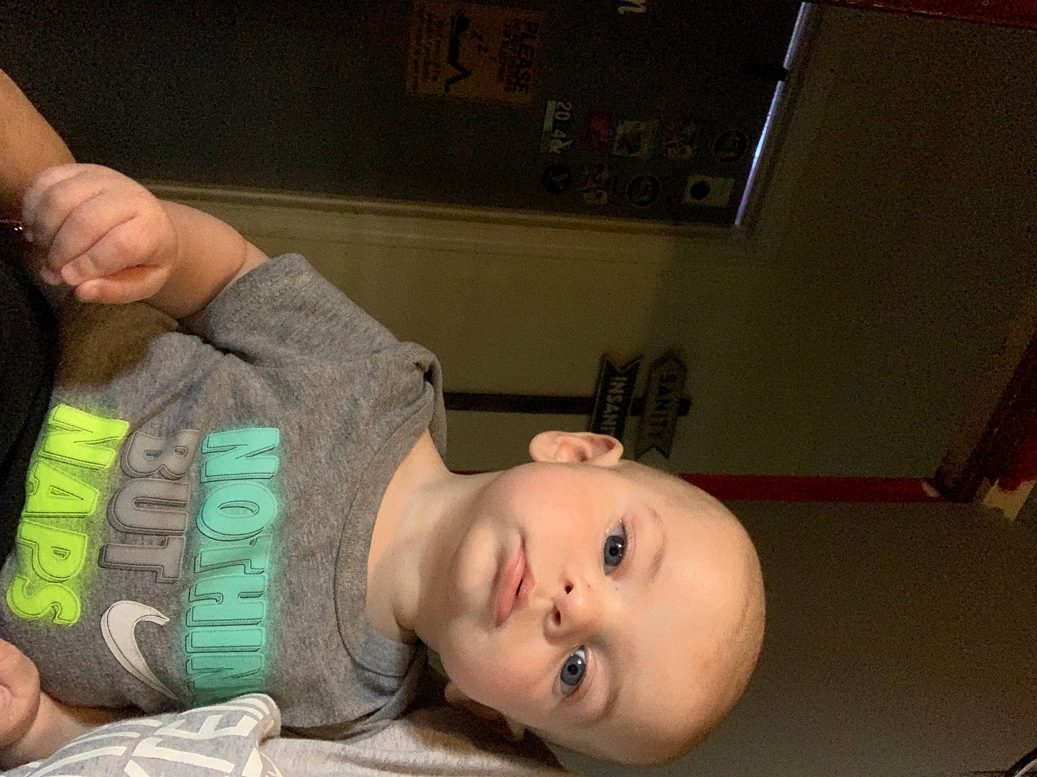 Colton is registered to the contest to win money with this photo: baby, baby_toddler_clothing, cheek, child, comfort, eye, eyelash, finger, flooring, gesture, human_body, mouth, neck, nose, person, picture_frame, room, skin, sleeve, toddler