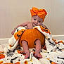 Santanna joined the competition — help win amazing prizes! baby, infant, pumpkin, orange_bow, halloween_blanket, blanket, cute, holiday, festive, smiling, face, legs, feet, indoors, soft_texture, child, costume, seasonal, decoration, portrait