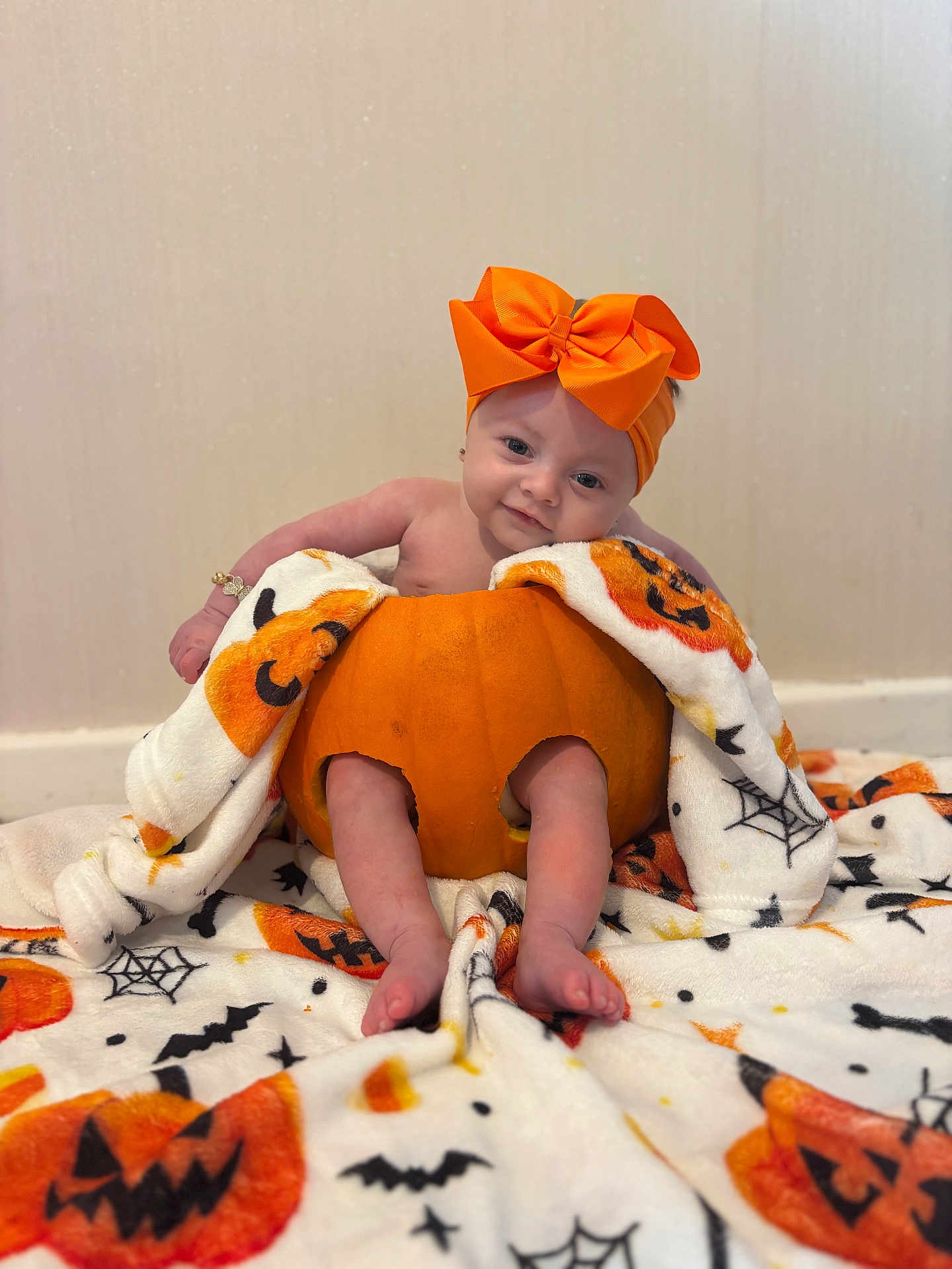 Santanna joined the competition — help win amazing prizes! baby, infant, pumpkin, orange_bow, halloween_blanket, blanket, cute, holiday, festive, smiling, face, legs, feet, indoors, soft_texture, child, costume, seasonal, decoration, portrait