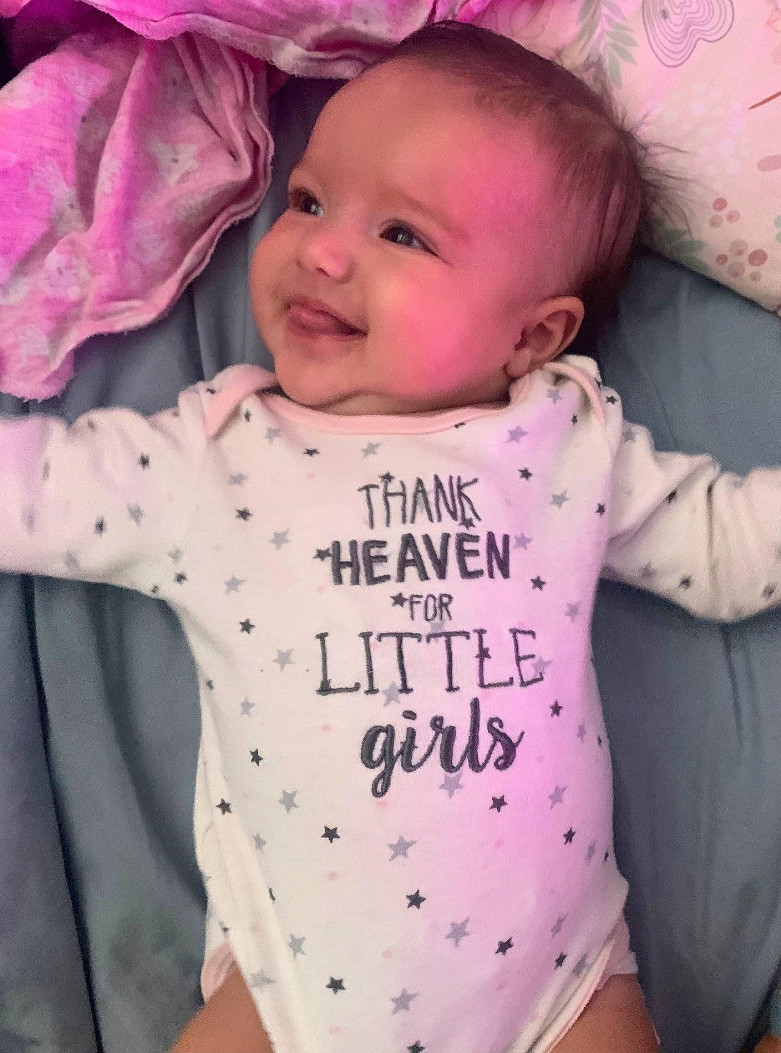 Naylani joined the competition — help win amazing prizes! baby, baby_toddler_clothing, cheek, cool, face, facial_expression, happy, head, joy, lip, outerwear, person, photograph, pink, product, skin, sleeve, smile, t_shirt, textile