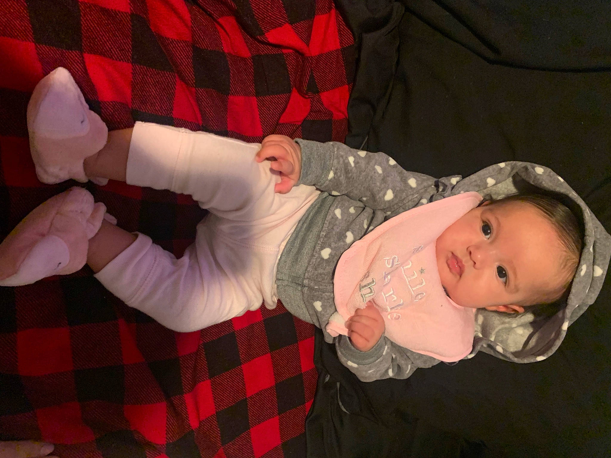 Naylani joined the competition — help win amazing prizes! baby, baby_toddler_clothing, carmine, child, comfort, design, gesture, hand, human_leg, lap, pattern, person, plaid, red, sleeve, smile, sock, tartan, textile, thigh