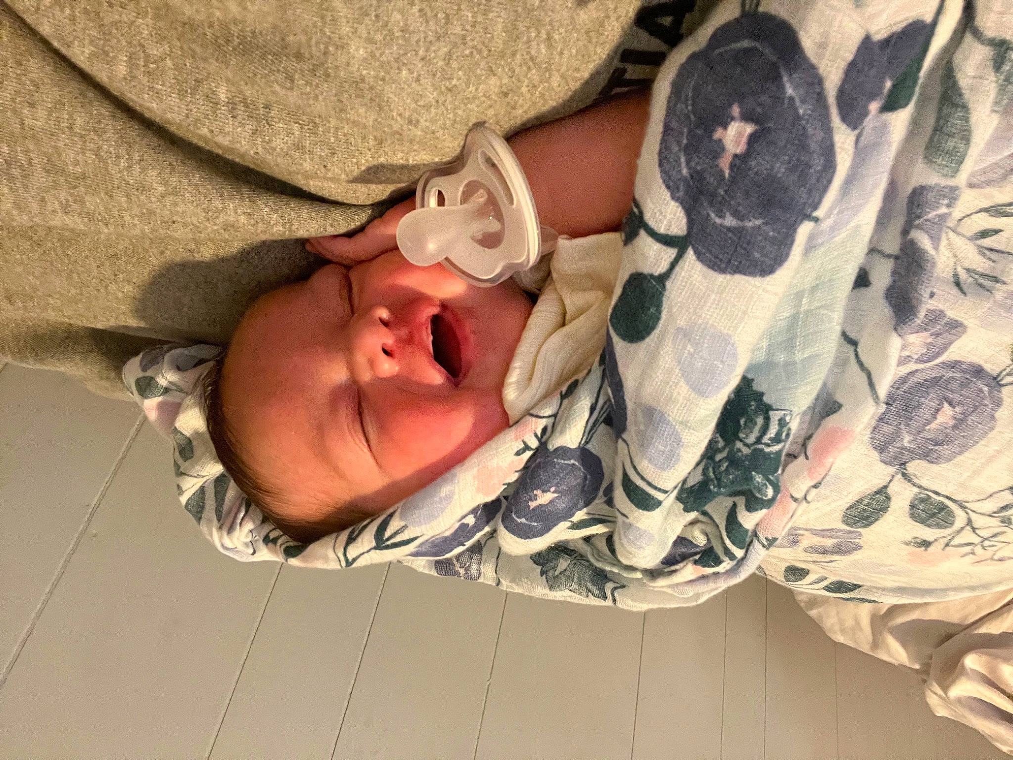 Naylani is registered to the contest to win money with this photo: baby, baby_products, baby_sleeping, baby_toddler_clothing, camouflage, child, comfort, gesture, glasses, hand, human_body, linens, military_camouflage, pattern, person, sleeve, smile, textile, toddler, tree