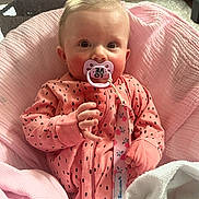 Kylie joined the competition — help win amazing prizes! baby, infant, pink_clothing, pacifier, blanket, crib, indoor, cute, child, portrait, sleepwear, baby_girl, cozy, soft_toys, toddler, hand, face, sitting, comfortable, curious