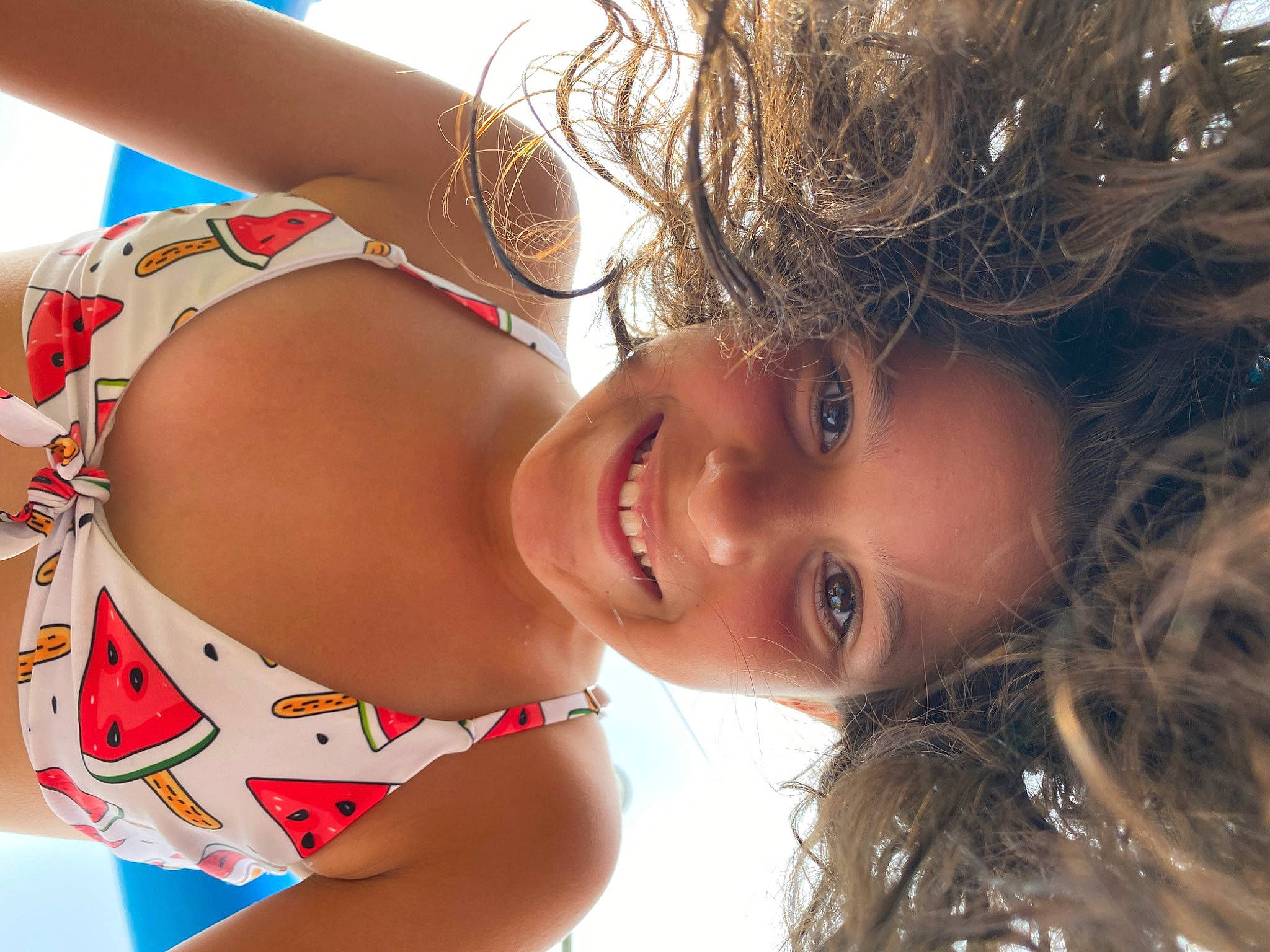Ema Flor participe au concours pour gagner de l'argent avec cette photo : black_hair, chest, chin, eyebrow, eyelash, fun, hair, happy, joy, lip, long_hair, mouth, neck, organ, person, skin, smile, sunlight, swimsuit_top, swimwear