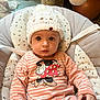 Eden a rejoint le concours — aidez-le/la à gagner de superbes lots ! baby, baby_seat, child, comfort, cushion, cute, expression, face, hand, hat, indoor, infant, knitted_hat, minnie_mouse, onesie, person, portrait, sitting, striped_clothing, toy